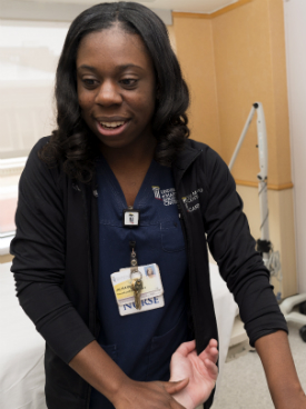 A neurology nurse interacts with a patient