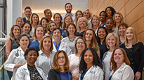 Large group of transplant nurse coordinators standing on stairs